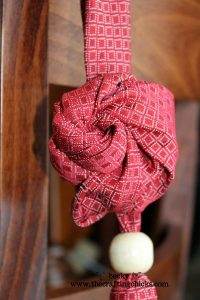 red-rosette-necktie-necklac