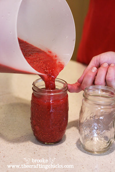 homemade-raspberry-jam-poured-into-jar