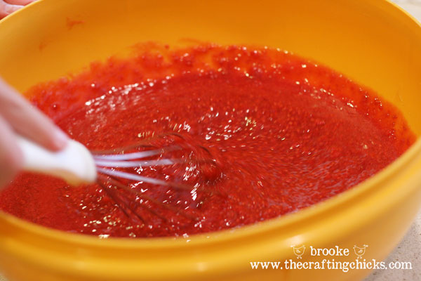 stirring-pectin-and-berries-homemade-raspberry-jam