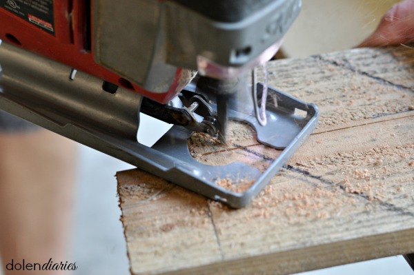cutting out monogram with a jigsaw tool