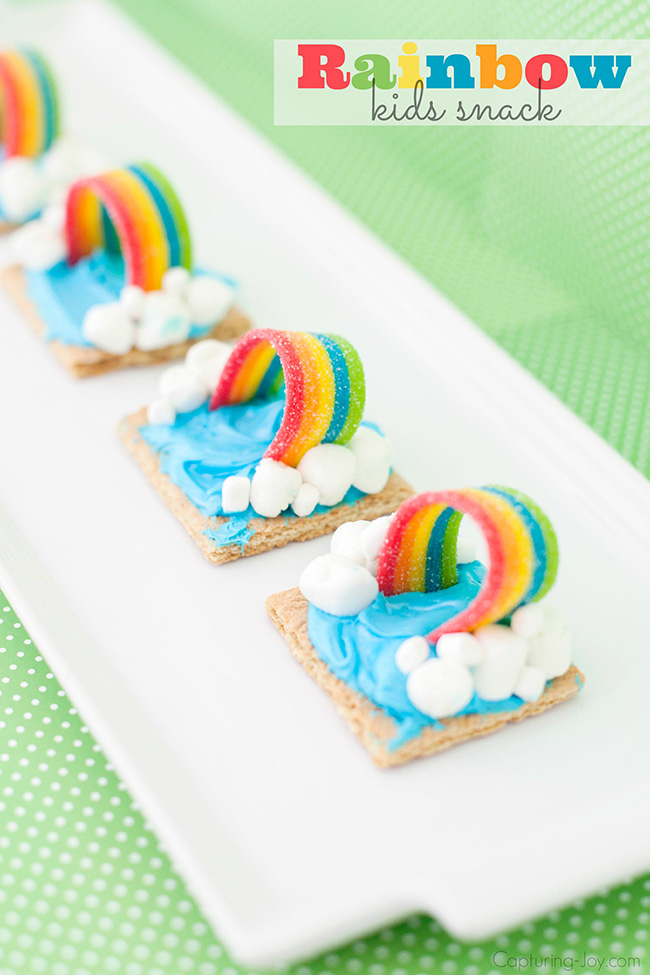 Rainbow kids snack made with graham crackers, blue icing, marshmallows and rainbow candies