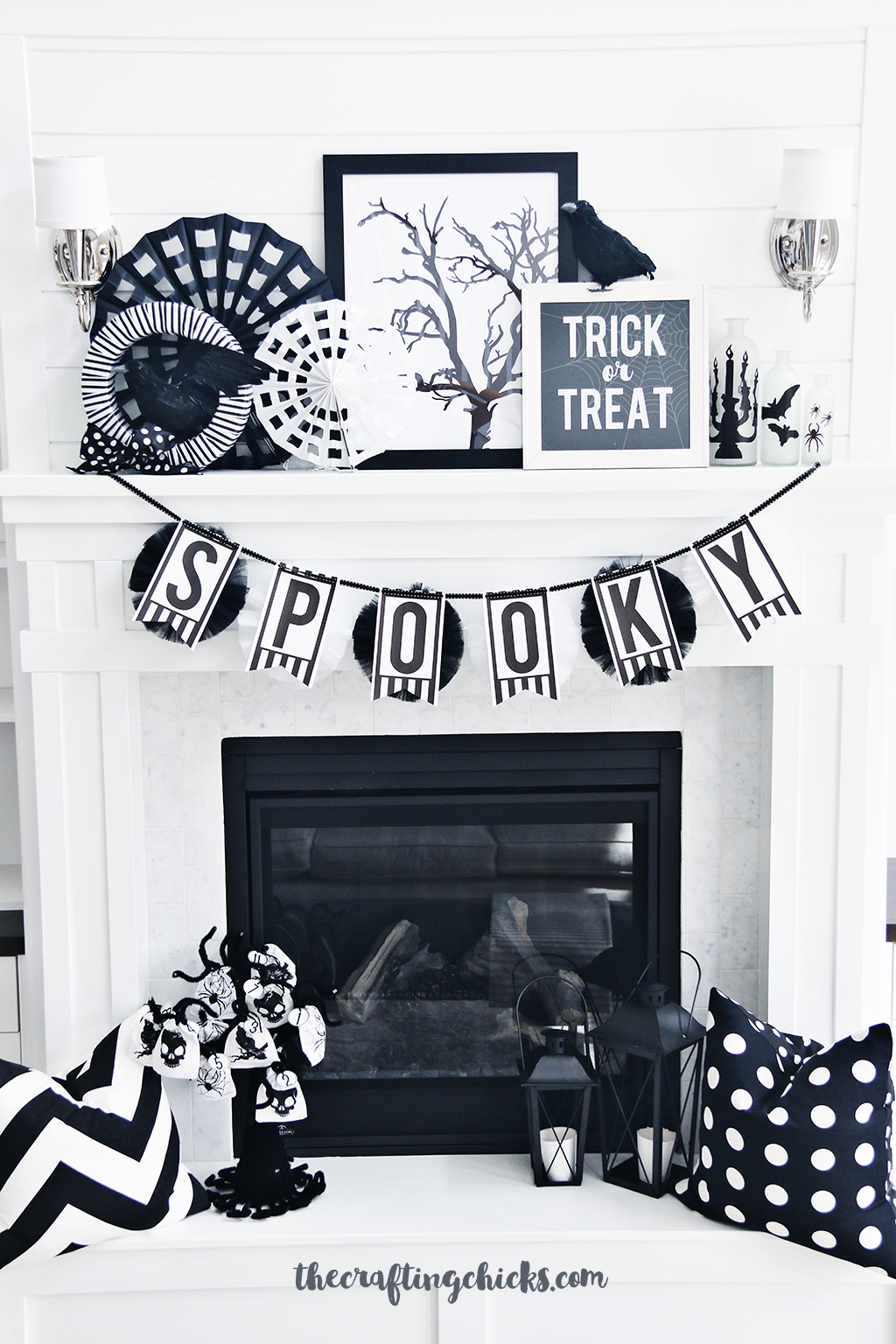 White mantle with black and white Halloween decorations