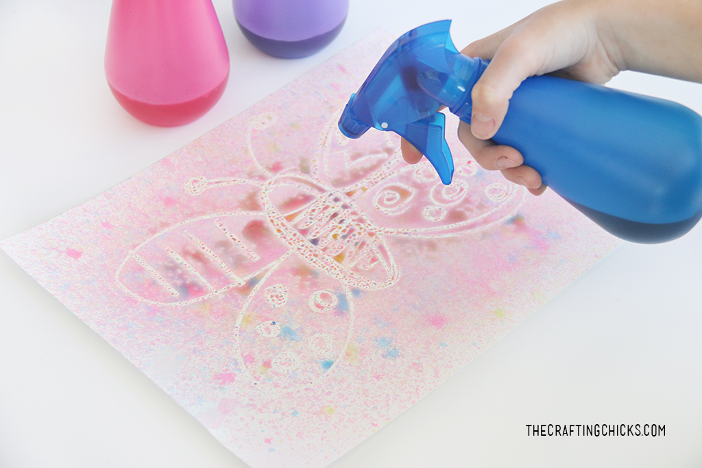 Crayon Resist Spray Bottle Painting for Summer fun Art! Paint outside with spray bottles and food coloring. A fun crayon resist art project for summer!