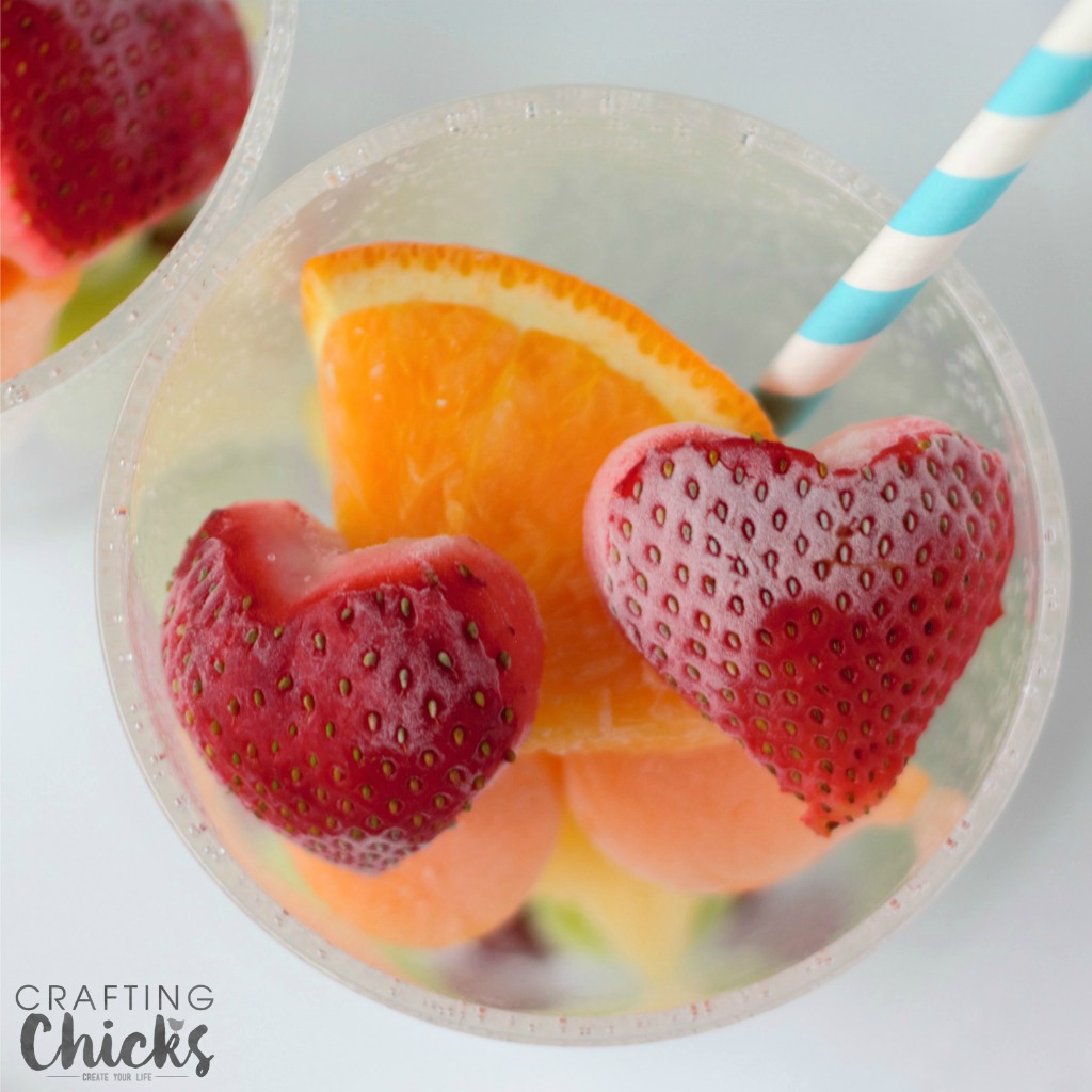 Rainbow Fruit Water with Frozen Fruit - love these frozen strawberry hearts