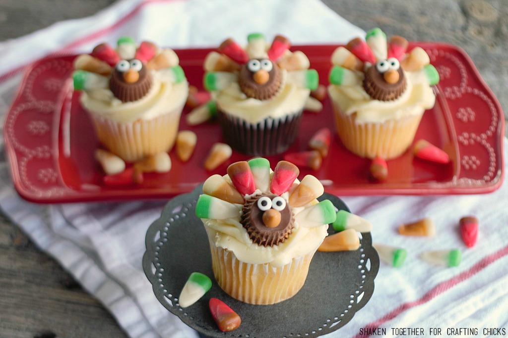 Colorful candy feathers and the cutest little faces, these Candy Corn Turkey Thanksgiving Cupcakes will be gobbled up in no time!