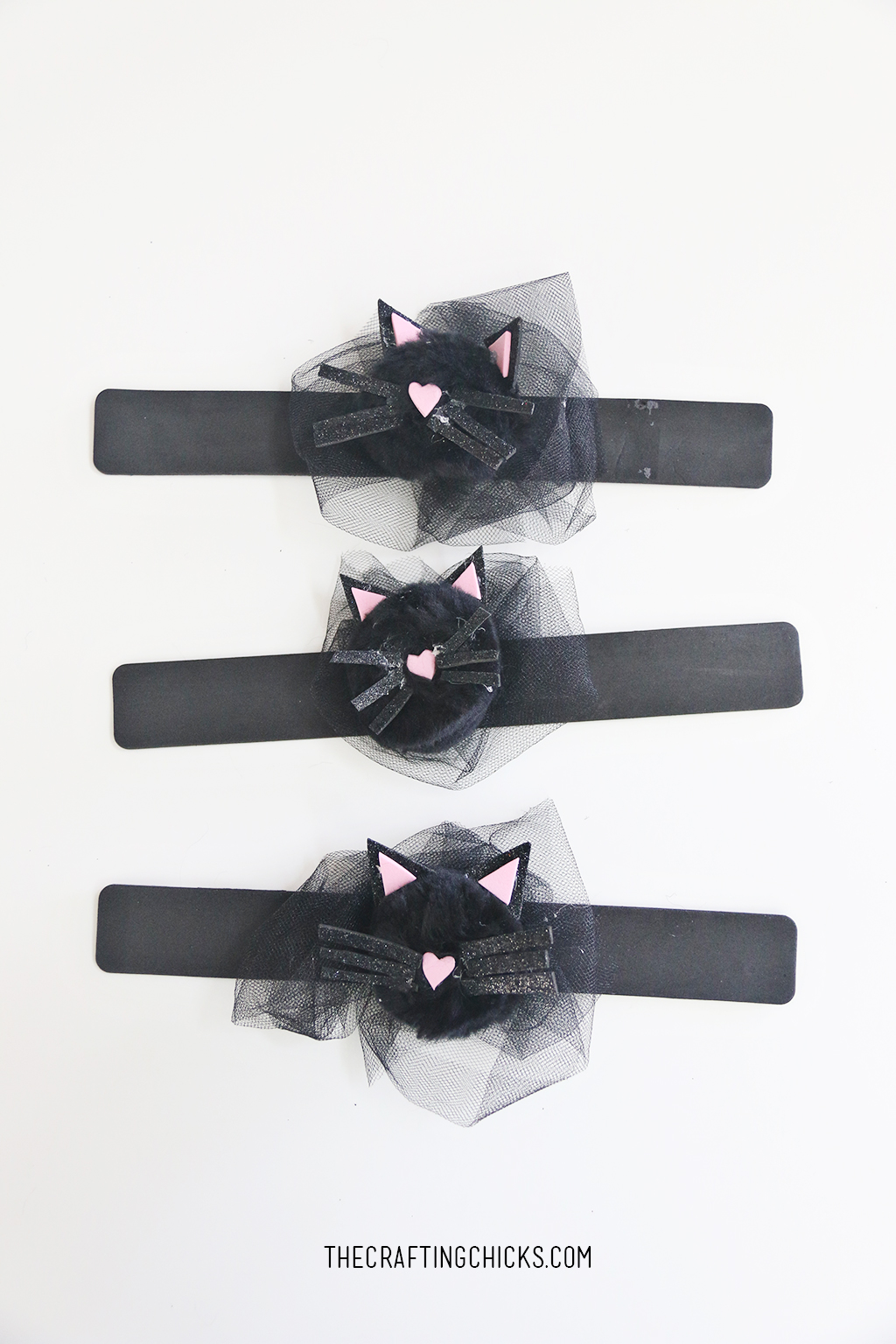 Cat Corsage Halloween Kid Craft for a fun Witch Tea Party! Kids will love creating this adorable cat craft for a Halloween Witch Tea Party!