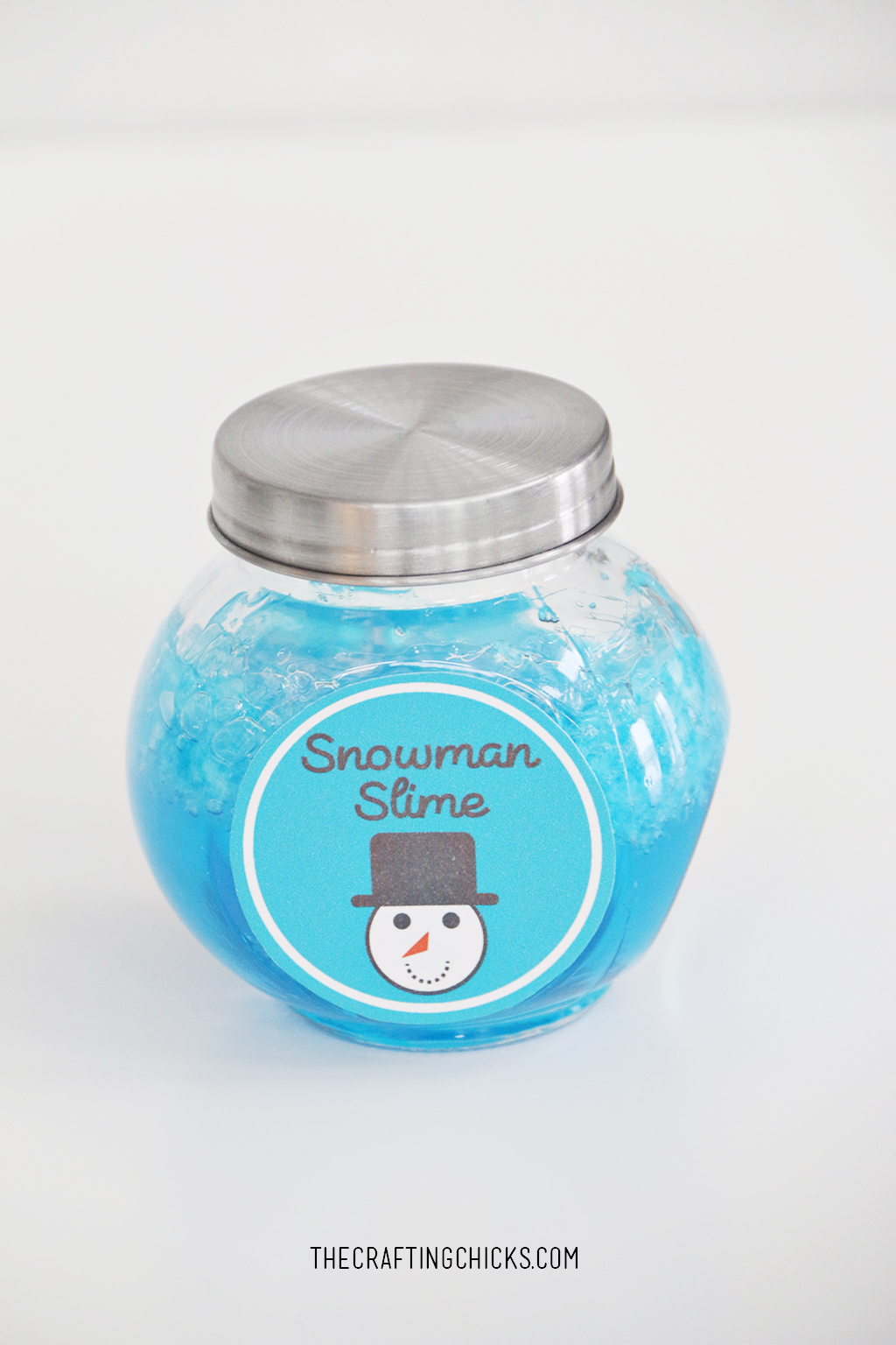 Blue Slime in a jar with a lid and take on jar that says Snowman Slime