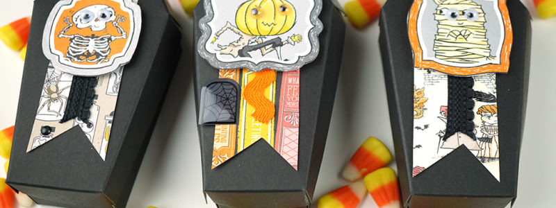 Black paper coffin treat holders decorated with cute Halloween paper for treat boxes