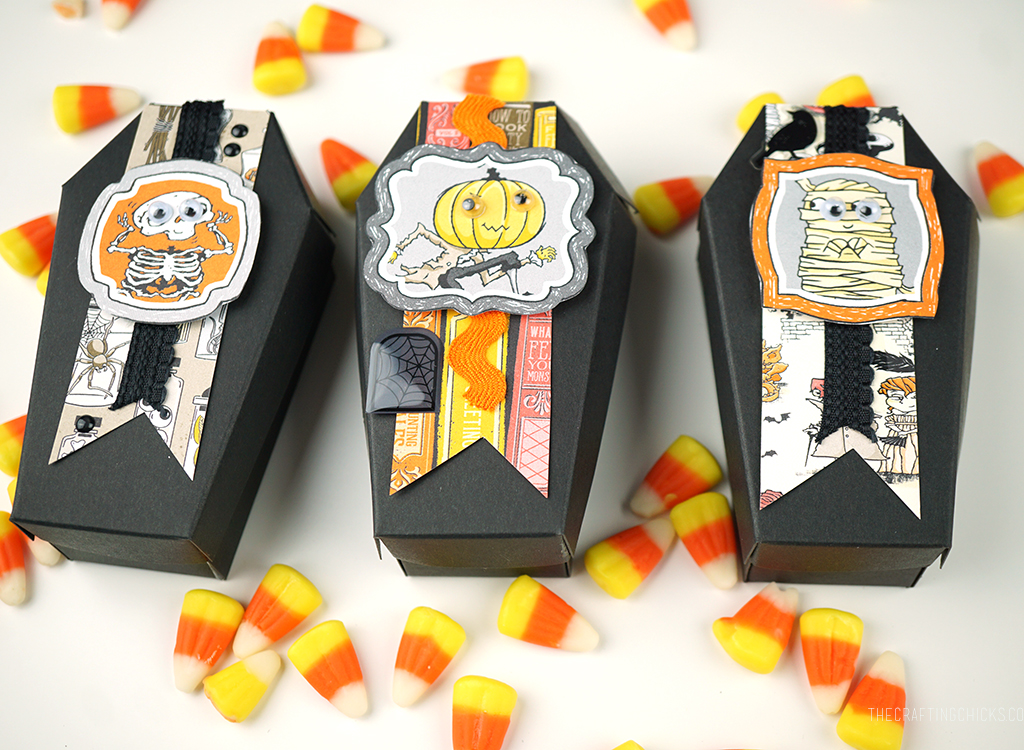 Black paper coffin treat holders decorated with cute Halloween paper for treat boxes