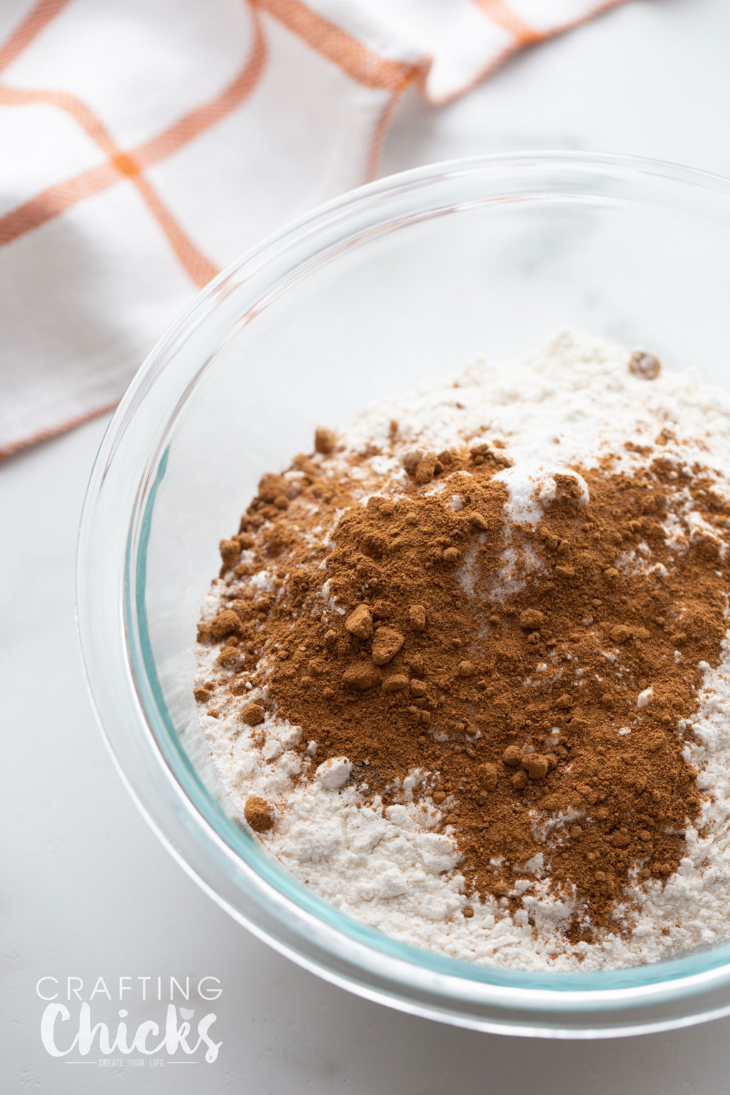 Dry ingredients for Soft and Chewy Pumpkin Molasses cookies mixed to gather in a clear bowl.