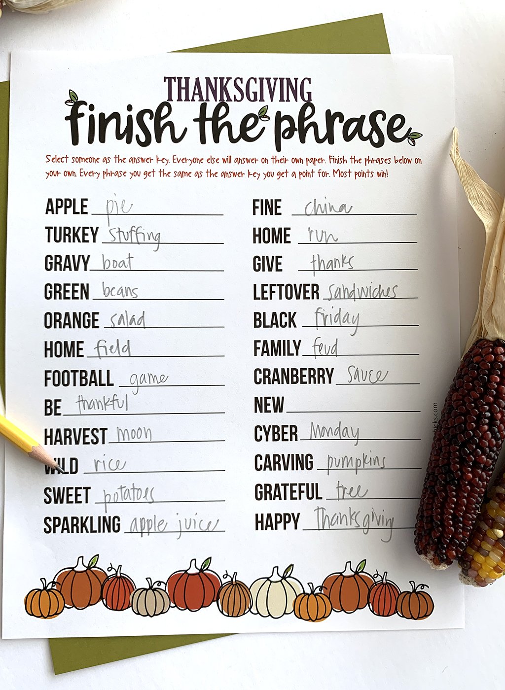 Thanksgiving Finish the Phrase game printed out and on a white background and green paper