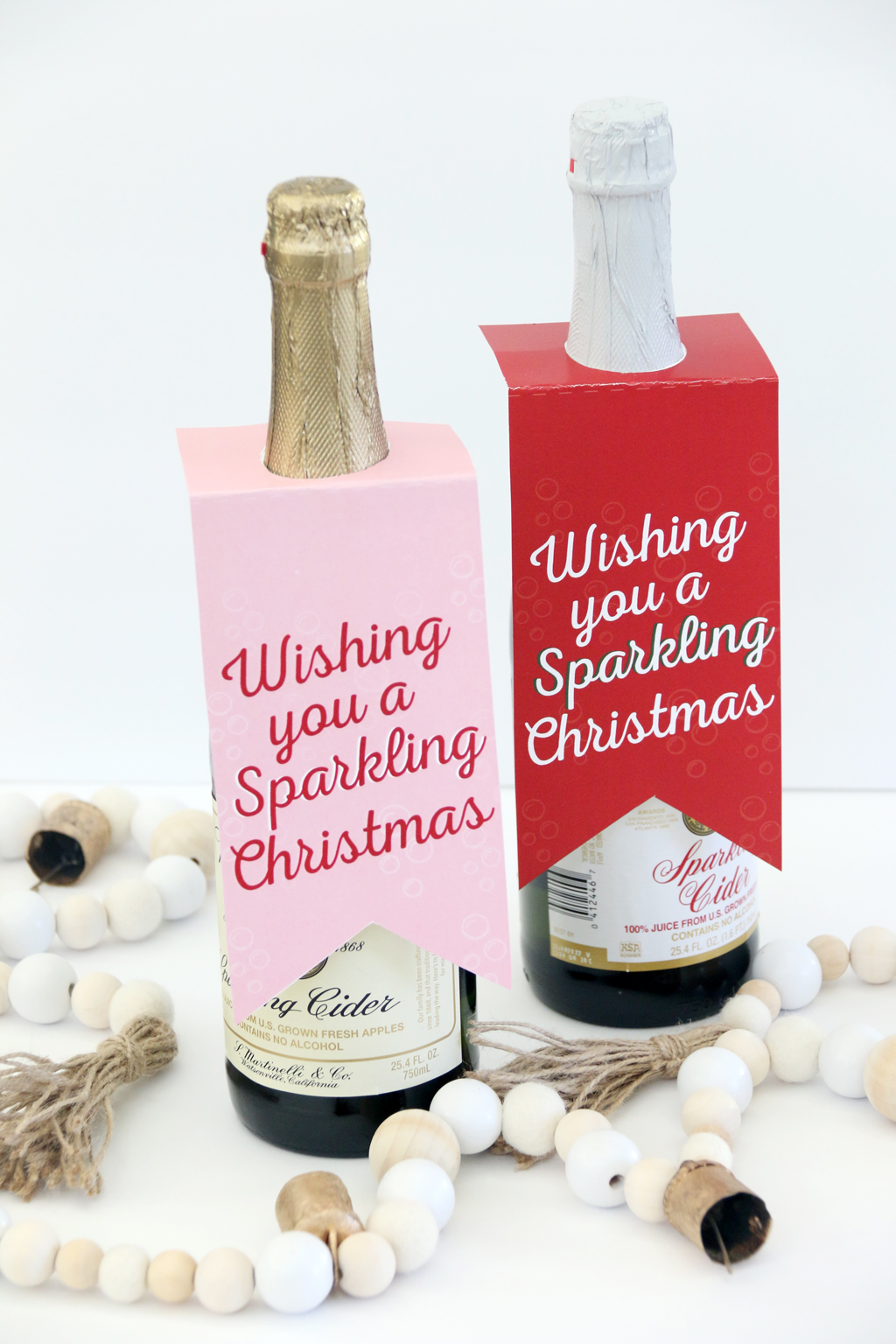 Two large bottles of sparkling cider with free printable gift tags in red and pink.