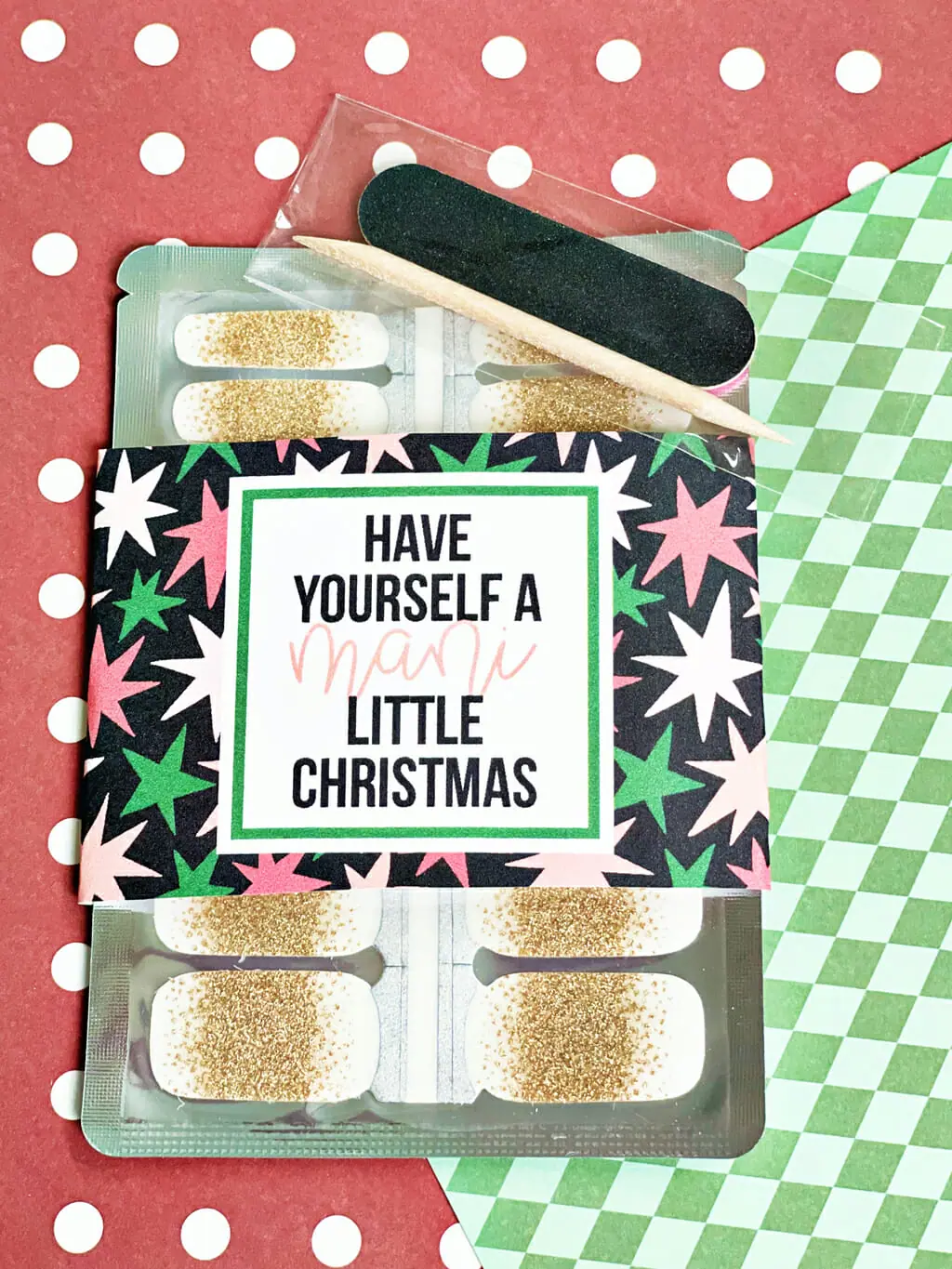 Have Yourself a Mani little Christmas gift tag wrapped around packaged holiday nail wraps
