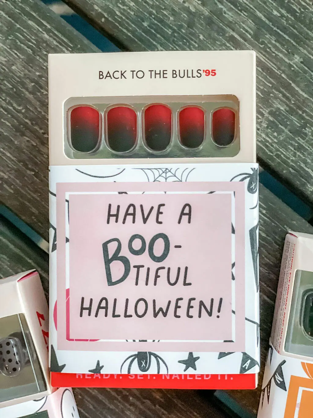 Back to the Bulls Hello Love Inc. press on nails in package with printable gift tag wrapped around the box.