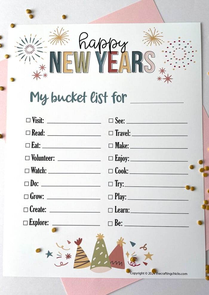 White paper with printable images of Happy New Years printable My bucket list for with blank line for the year.