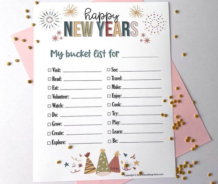 White paper with printable images of Happy New Years printable My bucket list for with blank line for the year.