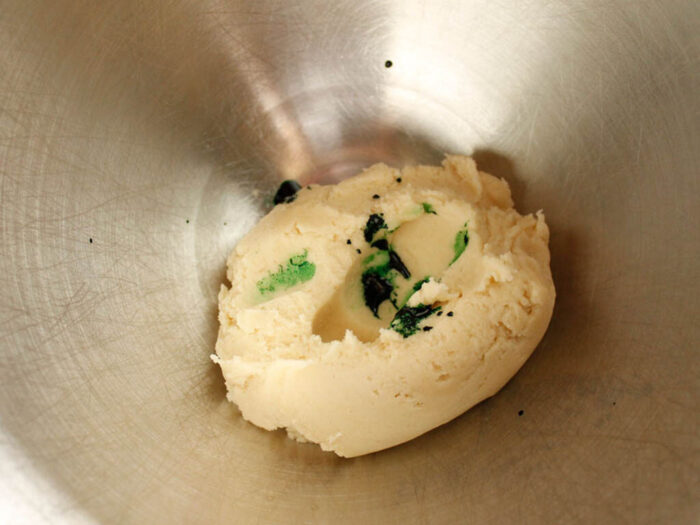 Pinwheel cookie dough with green food coloring.