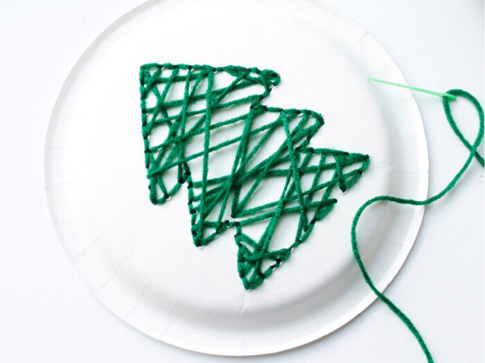 Paper plate Christmas tree craft with green yarn