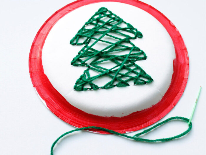 Paper plate Christmas tree craft with green yarn