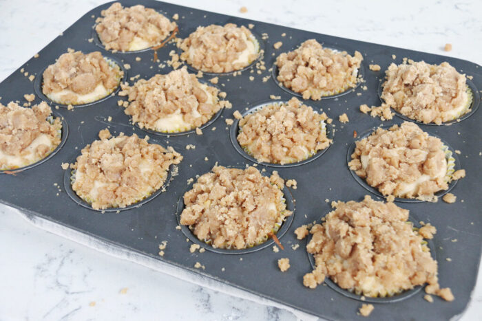 Apple crumble muffins with crumble topping added.