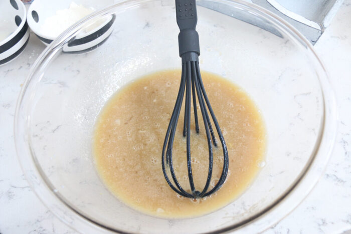 wet ingredients for apple crumble muffins in a bowl.