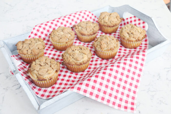 Freshly baked apple crumble muffins with cinnamon streusel topping