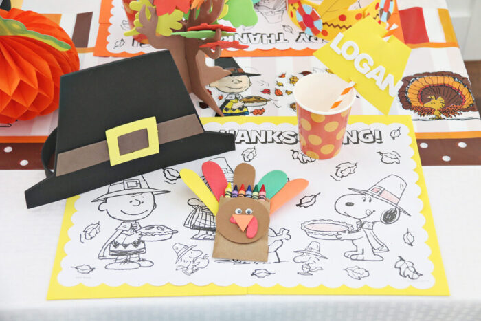 Kids Thanksgiving Table featuring Turkey Crayon Holders and coloring pages