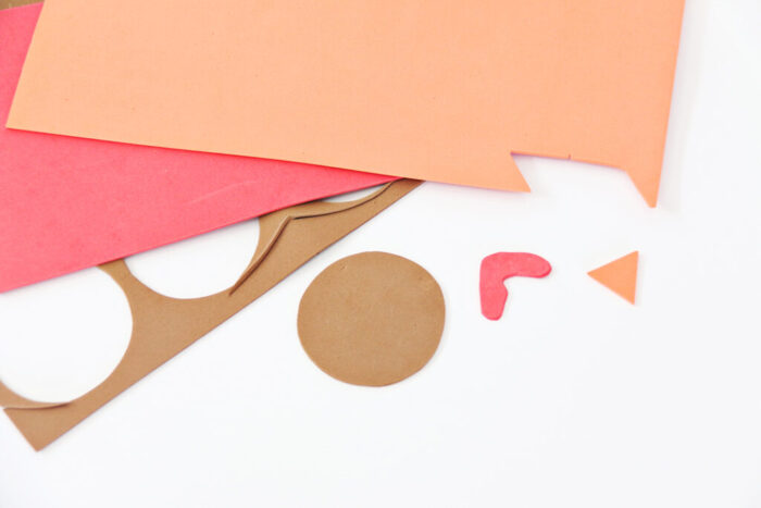 Thanksgiving Turkey craft with brown craft foam face and crayons as feathers.