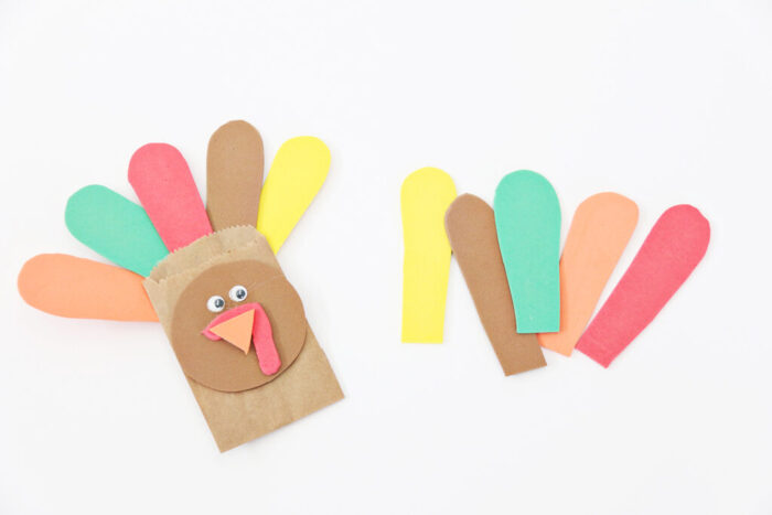 Thanksgiving Turkey craft with brown craft foam face and crayons as feathers.