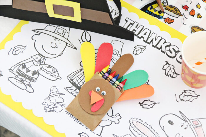 Kids Thanksgiving Table featuring Turkey Crayon Holders and coloring pages