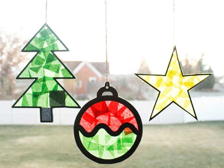 Close-up of a Christmas ornament suncatcher made with red and green tissue paper.